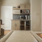 A couch and fridge in the Durham Office