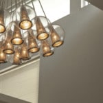 A large light fixture hanging over the lobby in the Durham Office