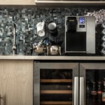 A coffee machine and refrigerator in the office lobby