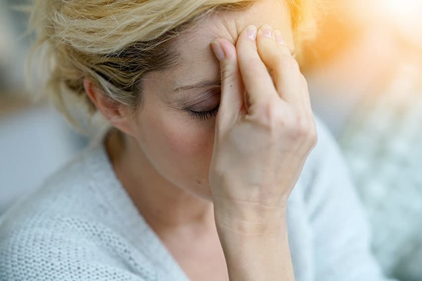 woman with a pressure headache