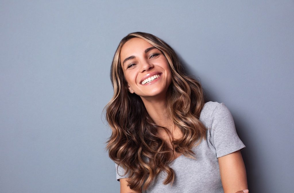 Girl showing off her beautiful smile