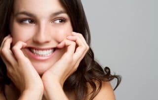 cute young woman showing off her unique smile